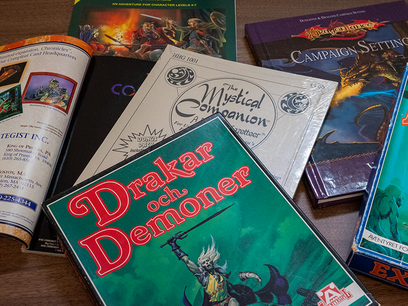 A pile of old school dnd and roleplaying books